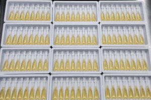 Filled spot-on pipettes in trays after mixing and filling